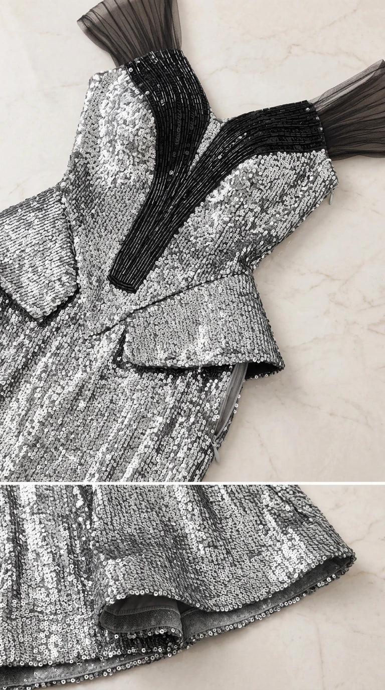 Close-up detail of bodice sequin work, contrast piping, and peplum structure