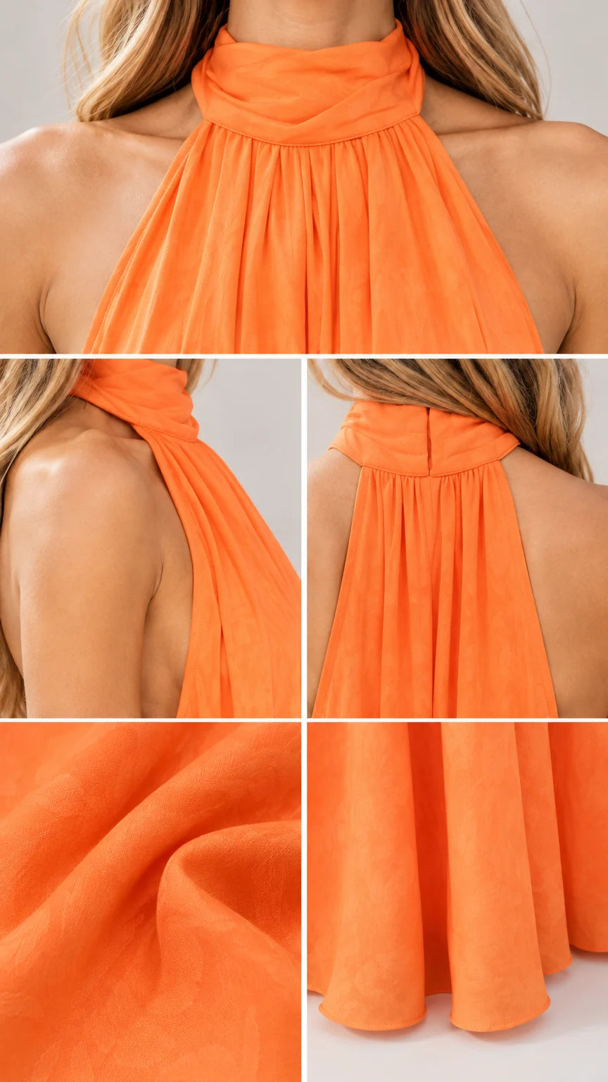 Detailed close-ups of gathered halter collar and hem of orange flowy jumpsuit