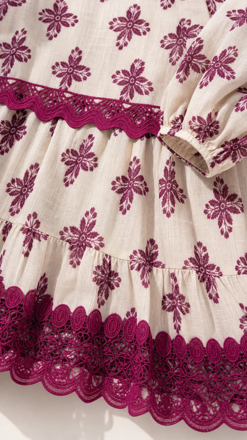 Close-up detail of embroidered hem and fabric texture
