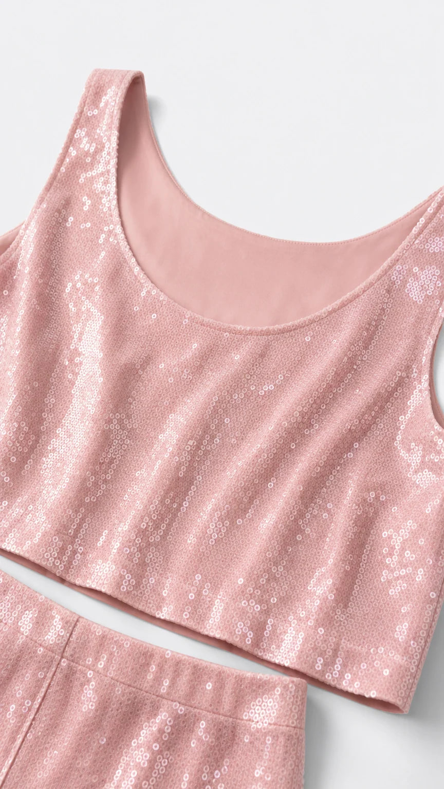 Close-up detail of scoop neck sequin crop top with smooth inner lining
