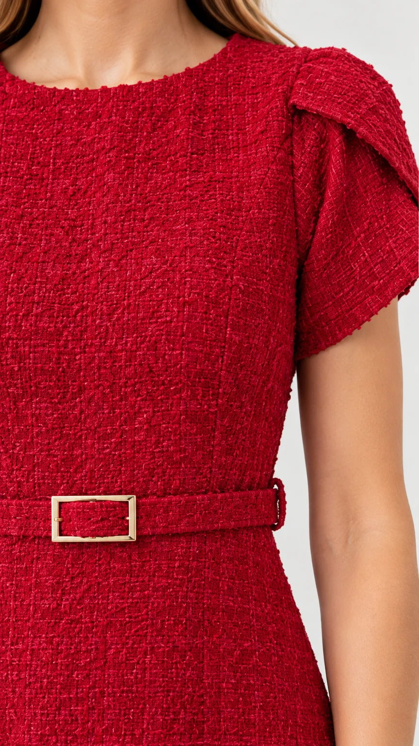 Close-up detail of red tweed fabric texture, round neckline, and petal sleeve construction