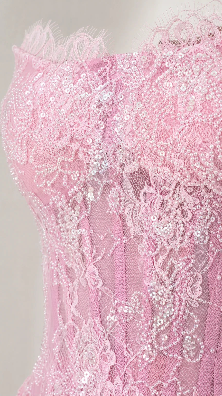 Close-up detail of lace texture and sequins on the bodice