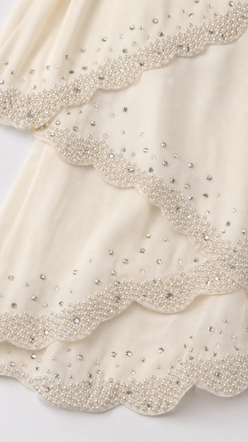 Close up detail of beaded scalloped tiers
