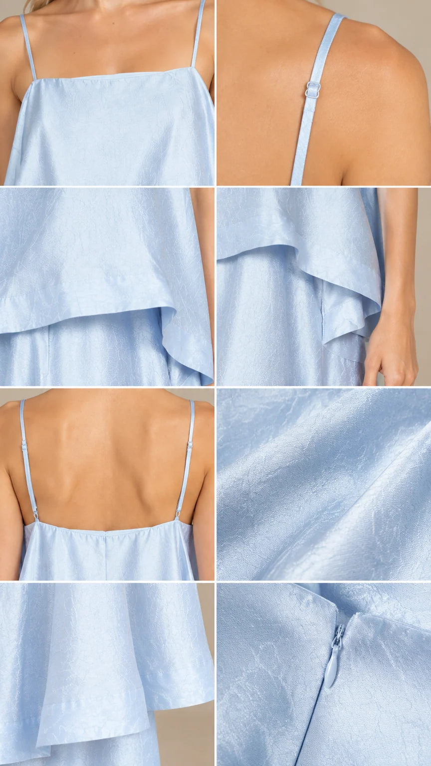 Detail view of light blue tiered cami dress straps, tiers, and zipper