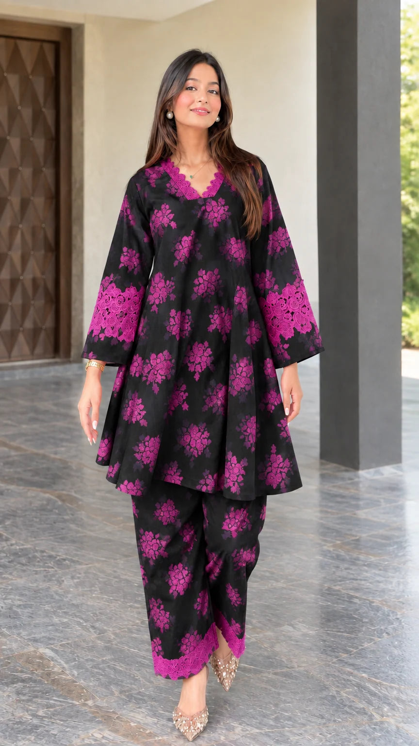 Front view of black floral print two-piece tunic and pant set