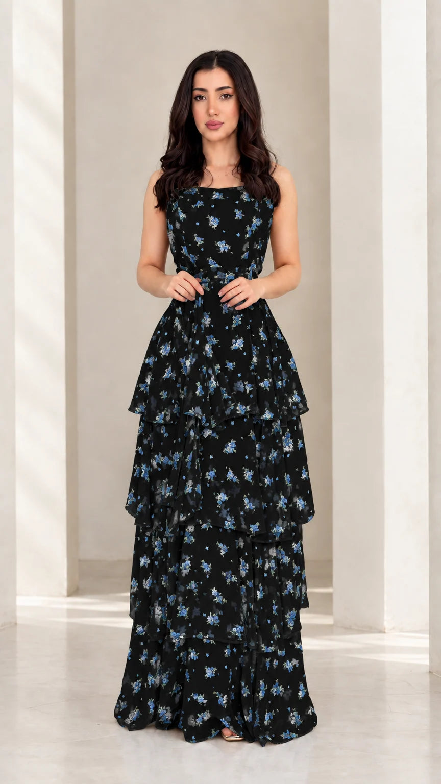Model wearing black floral tiered ruffle spaghetti strap maxi dress