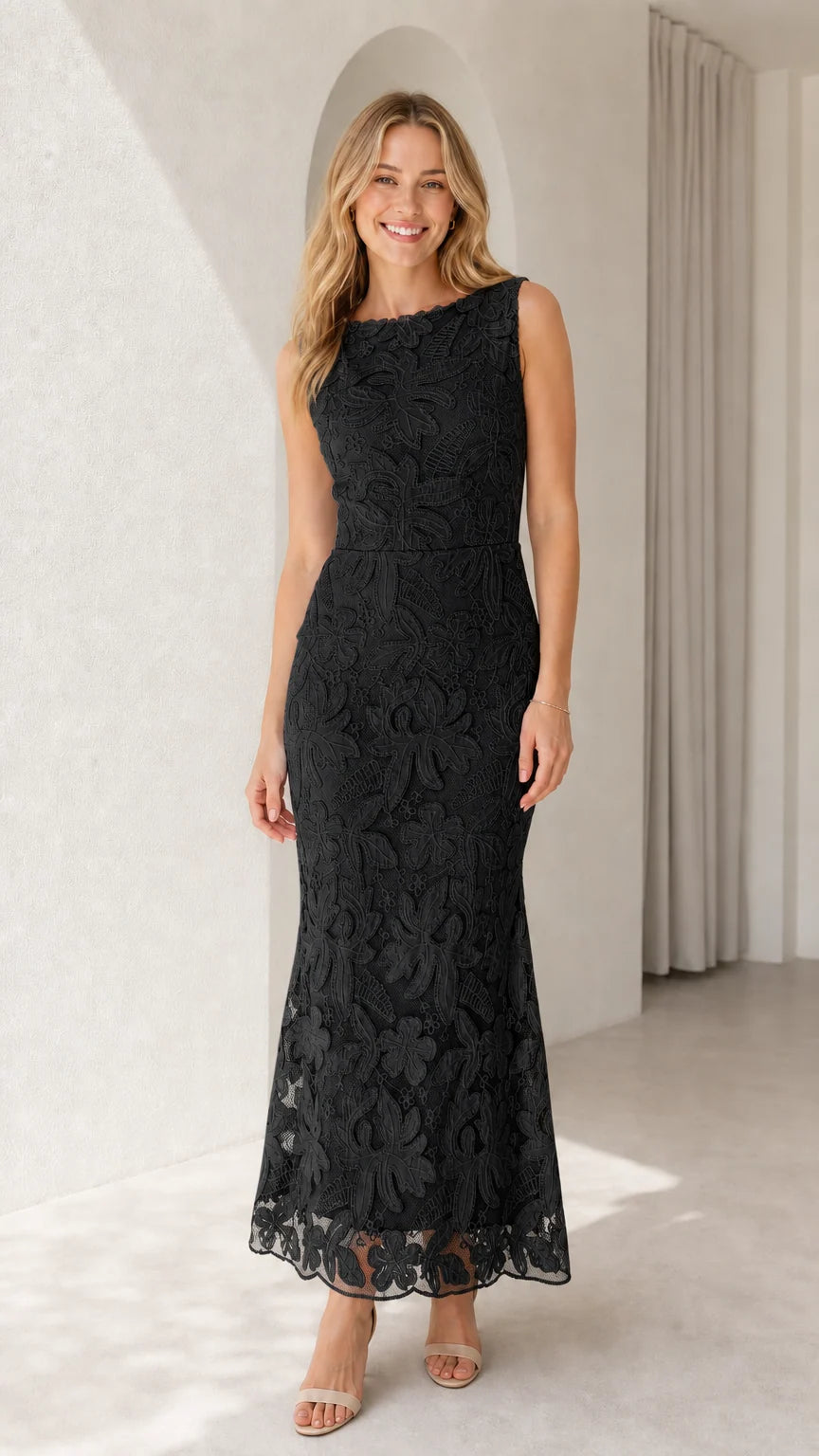 Model wearing black sleeveless floral lace formal evening gown