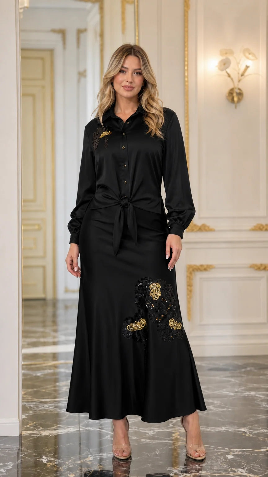Front view of black satin blouse and maxi skirt set