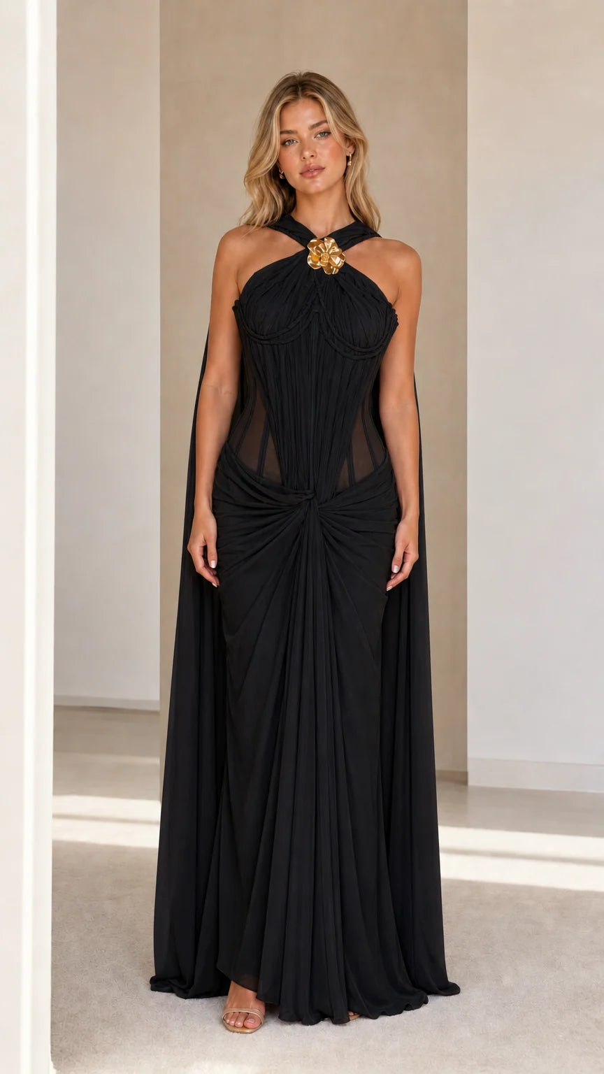 Model wearing black evening cape maxi dress