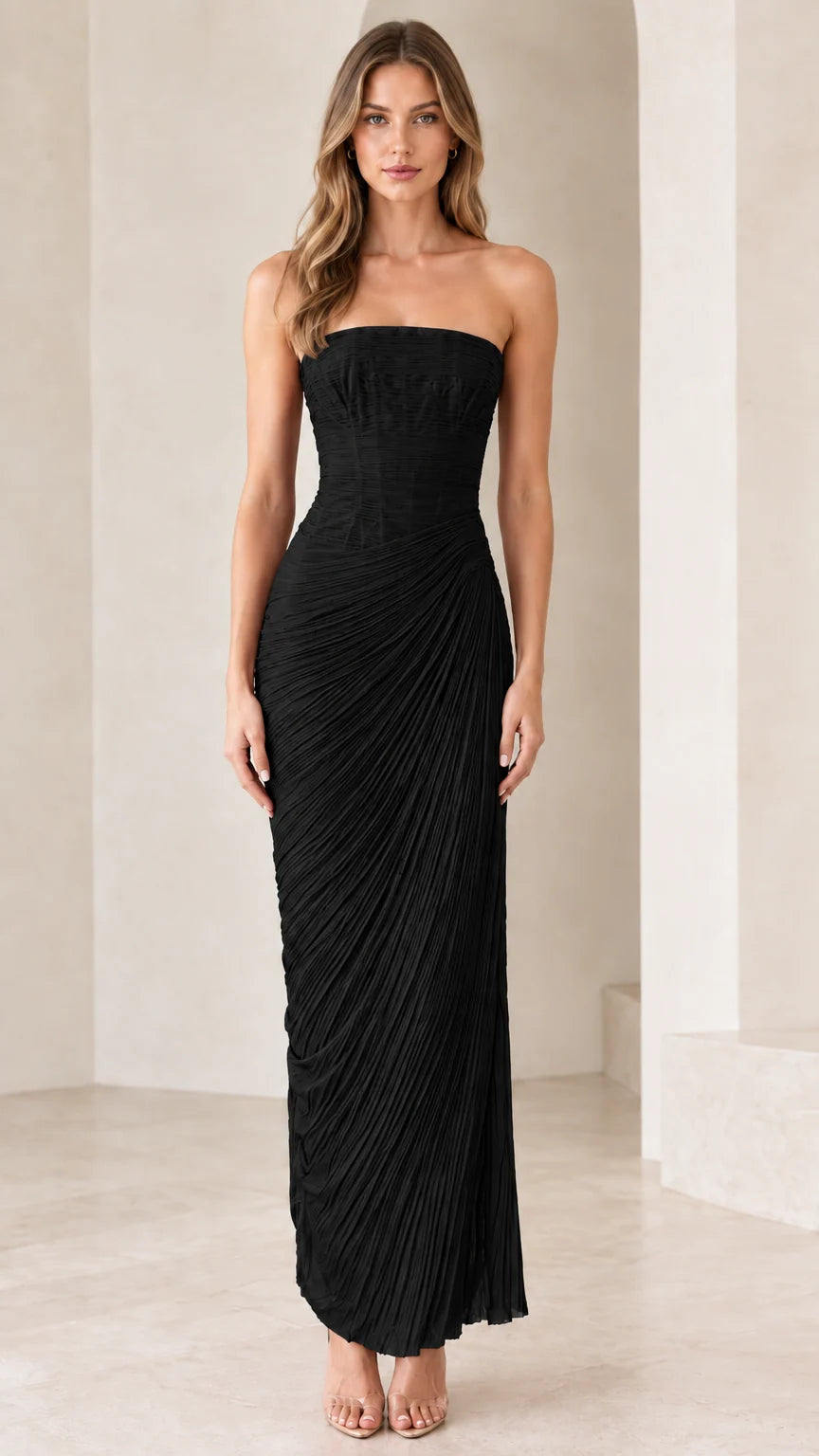 Model wearing strapless black ruched column evening gown