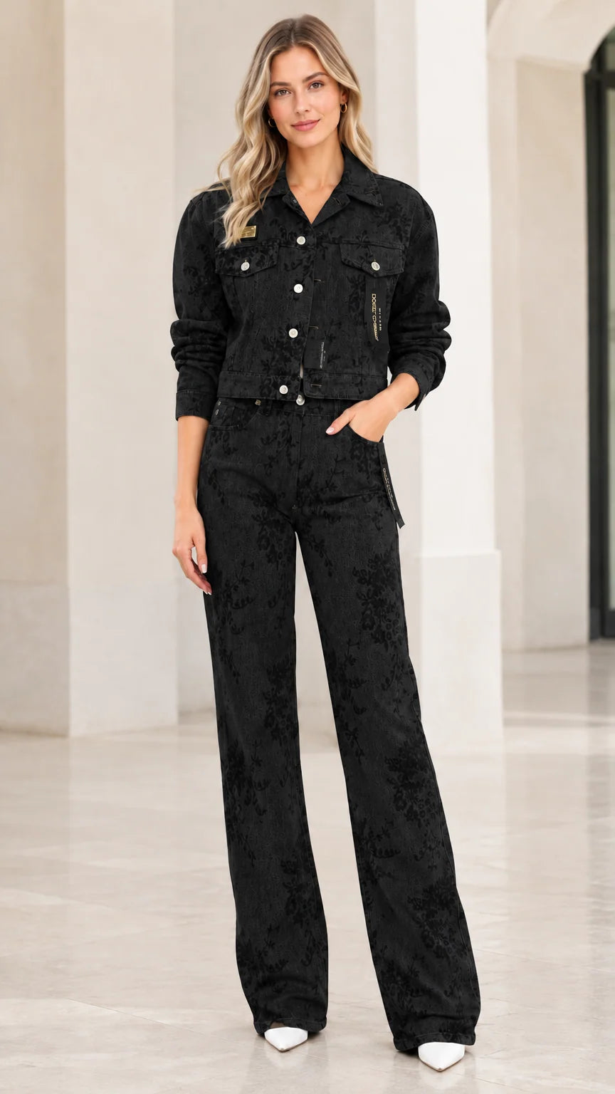 Model wearing black floral embossed denim cropped jacket and matching wide-leg trousers