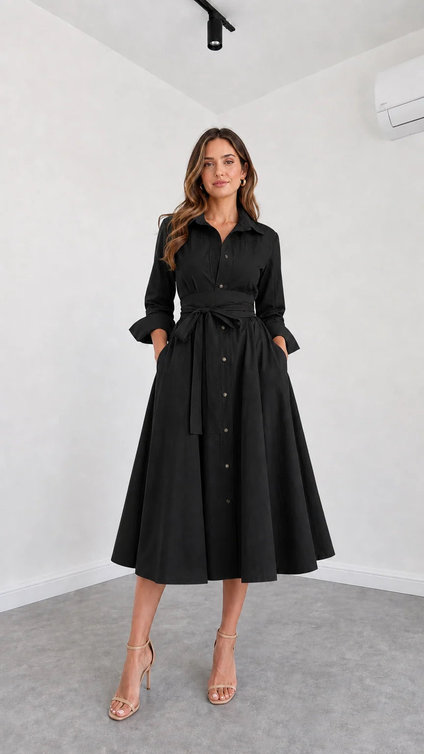 Front view of model wearing Black button-down belted midi shirt dress
