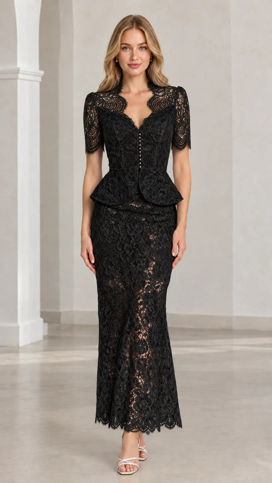 Front view of woman wearing black floral lace peplum maxi two-piece set