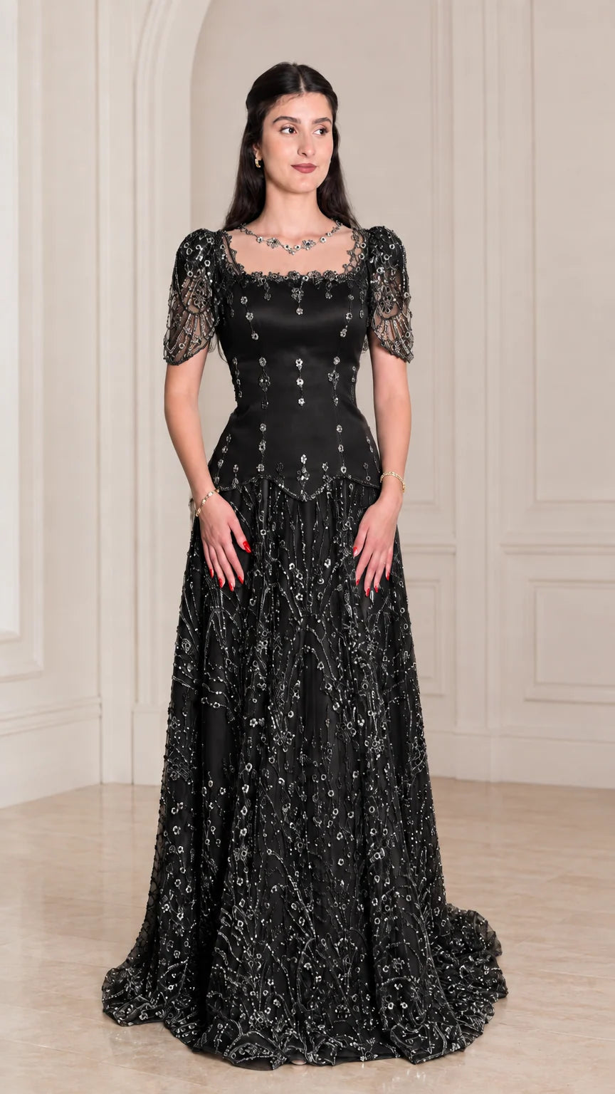 Model wearing classic Black beaded short sleeve evening gown