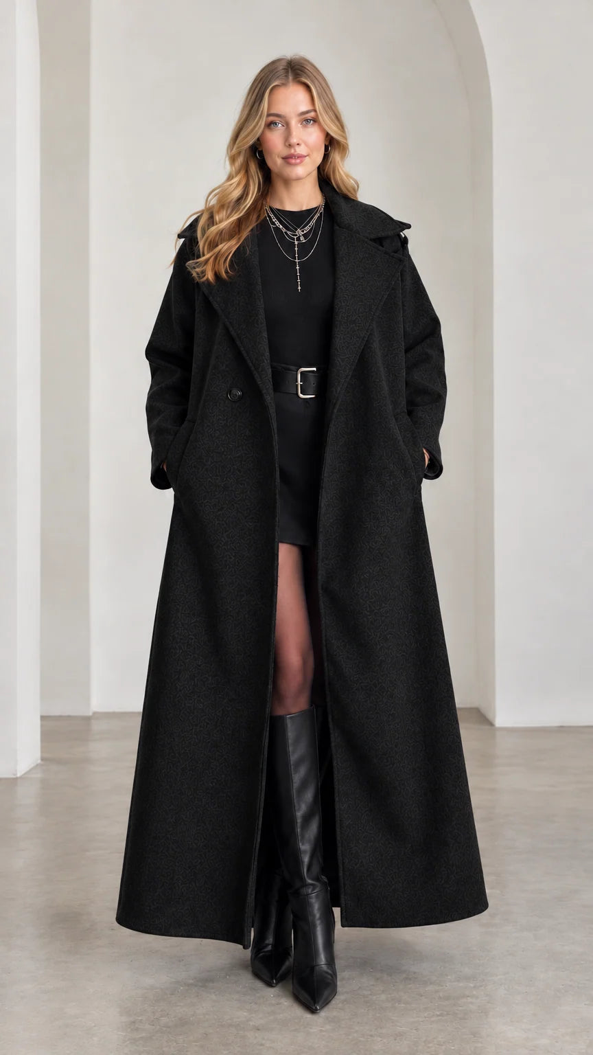 Model wearing classic Black maxi-length tailored overcoat with boots