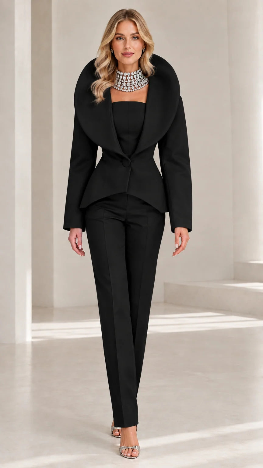 Front view of model wearing classic Black dramatic shawl collar pant suit