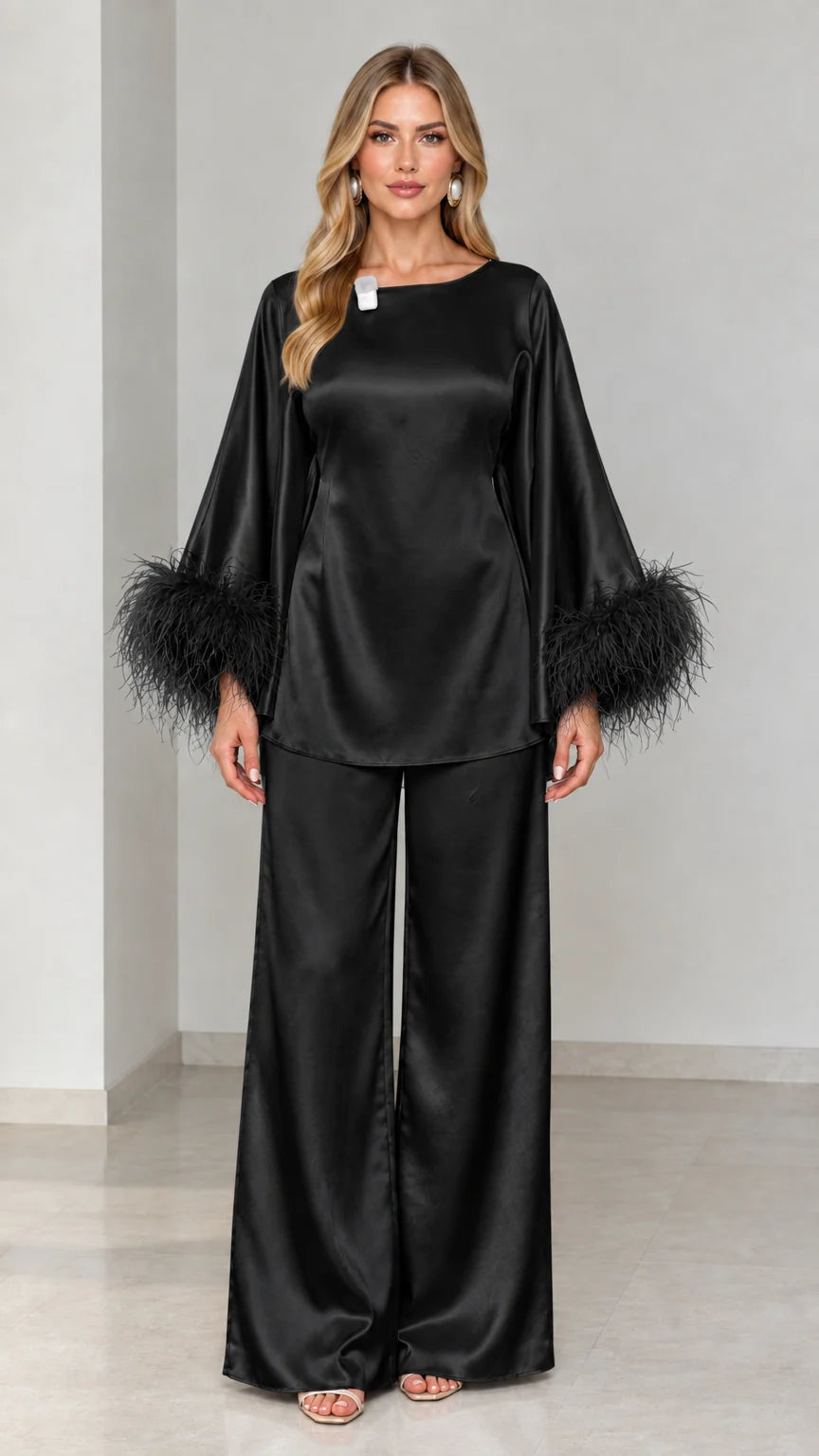 Black satin two-piece long sleeve top and wide-leg trousers with feather cuffs