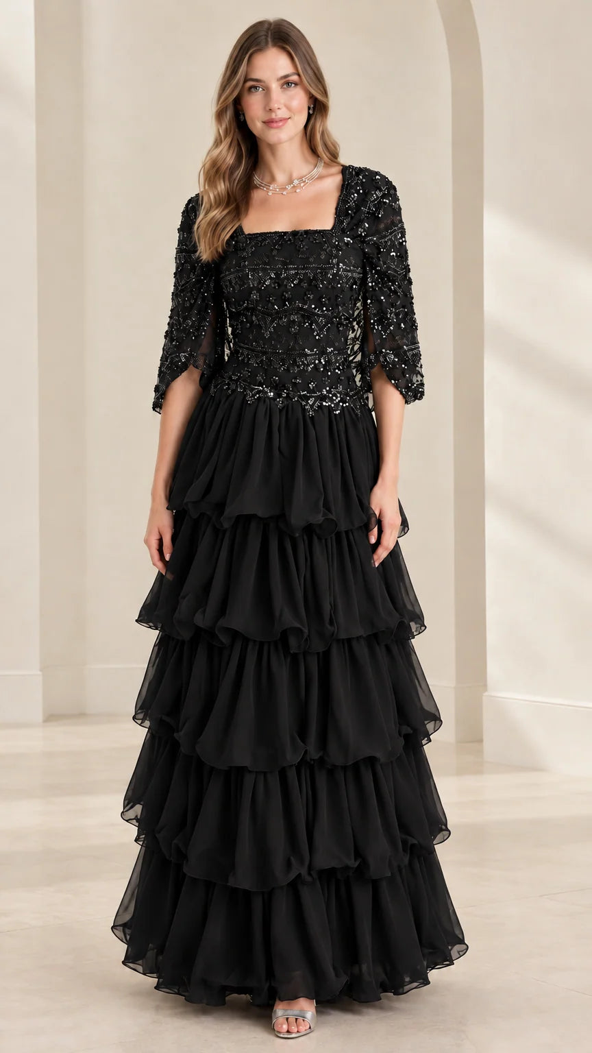 Full view of black sequin bodice tiered ruffle maxi formal evening gown