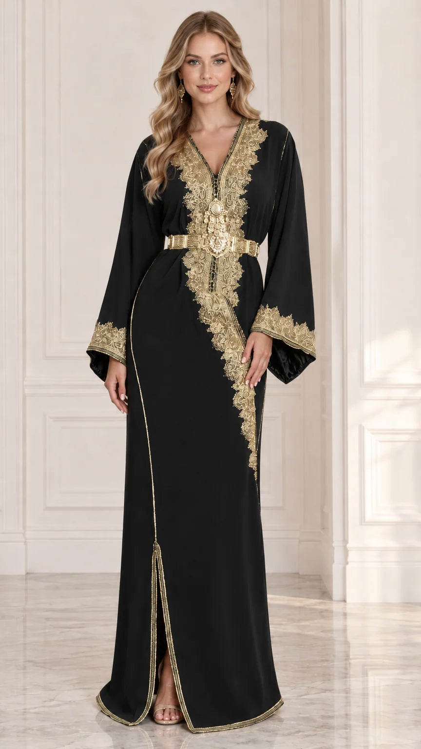 Front view of model wearing black Moroccan kaftan dress with gold embroidery and belt