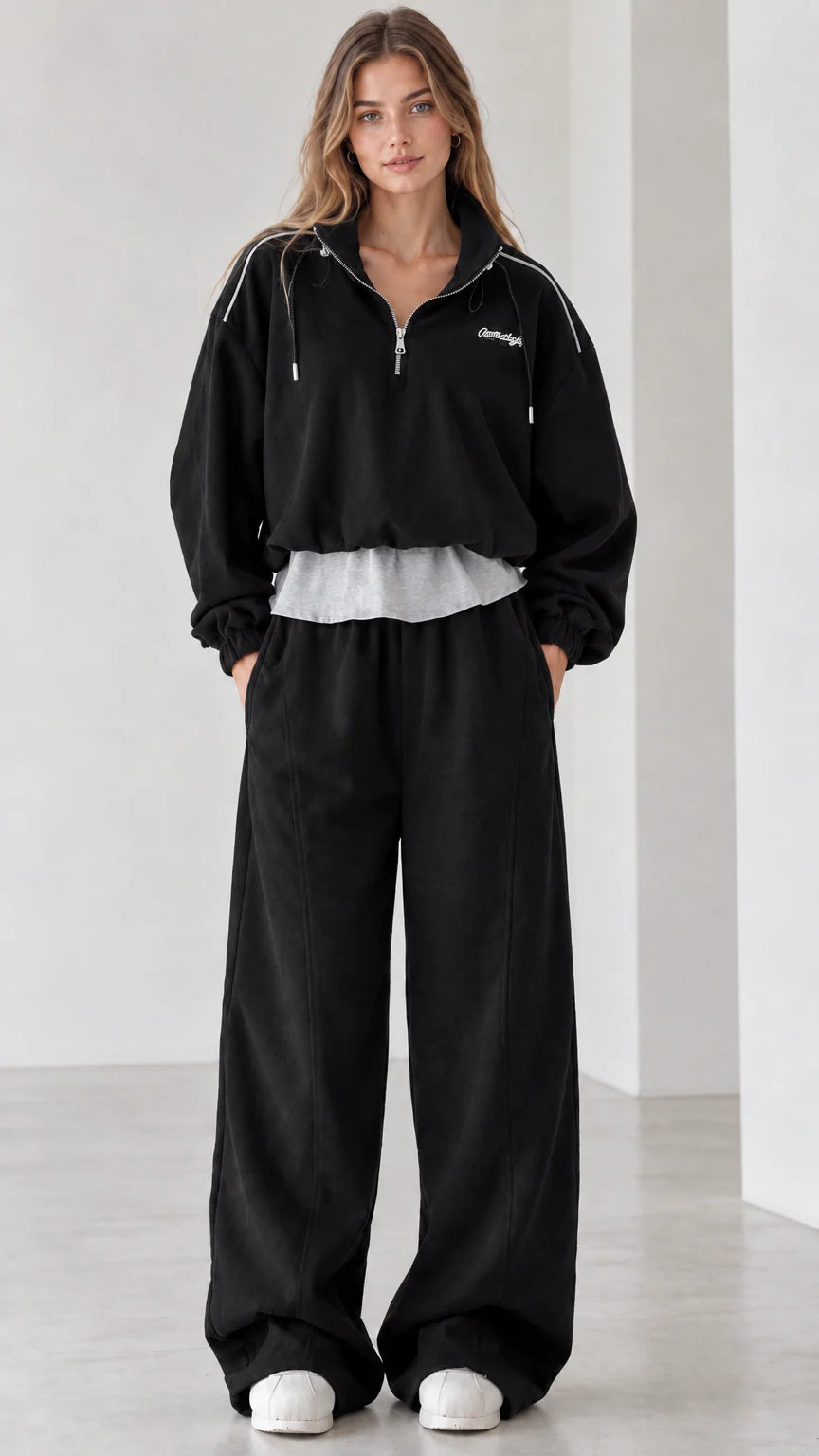 Women's black two-piece half-zip sweatshirt and wide-leg sweatpants set