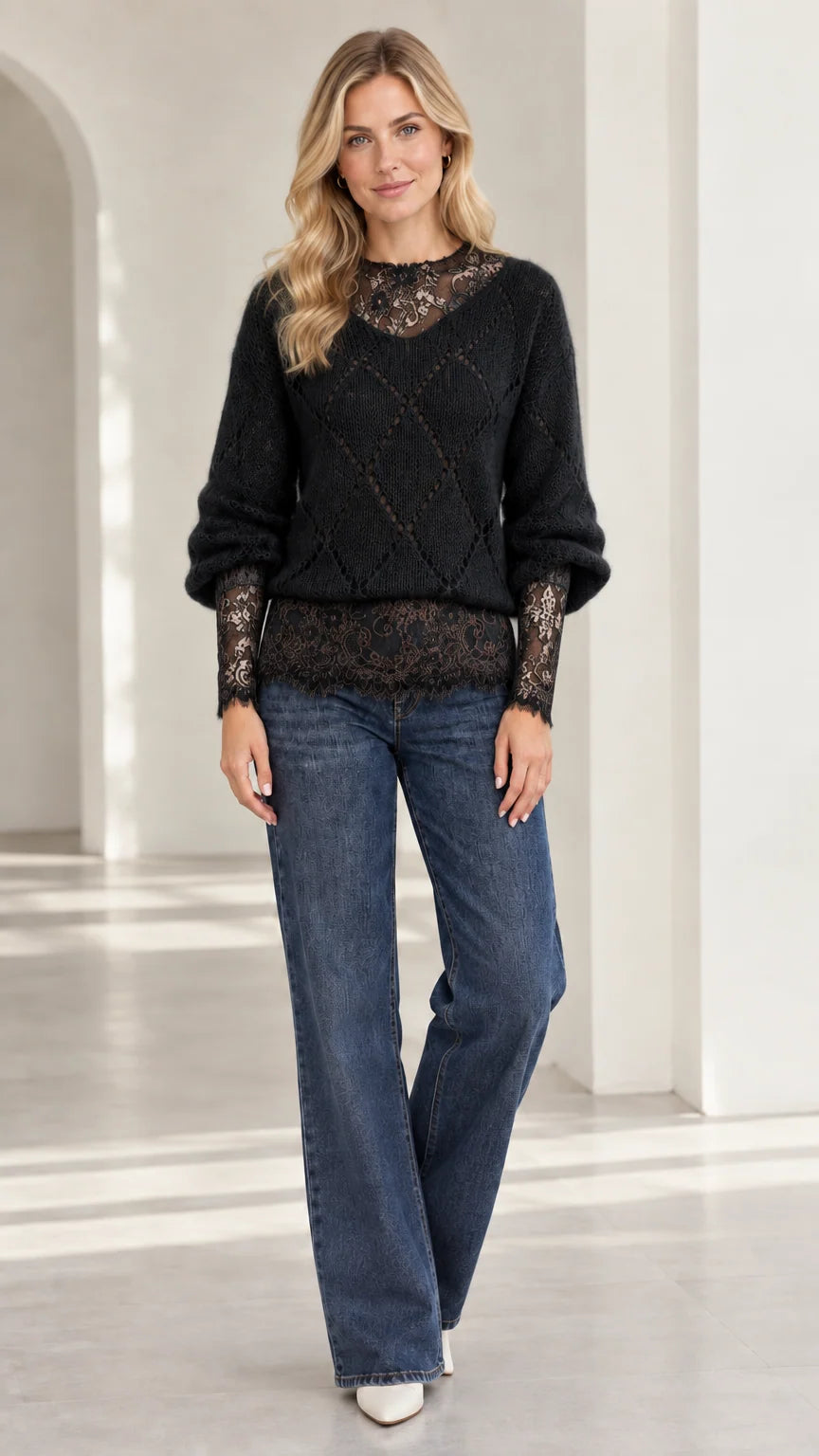Model wearing black diamond knit sweater with black floral lace detailing