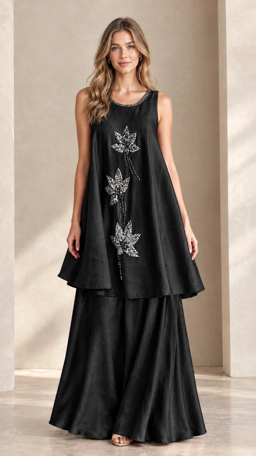 Front view of black sleeveless beaded tunic and palazzo pant set