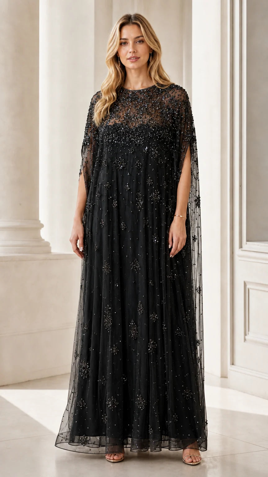 Front view of black beaded mesh cape maxi dress