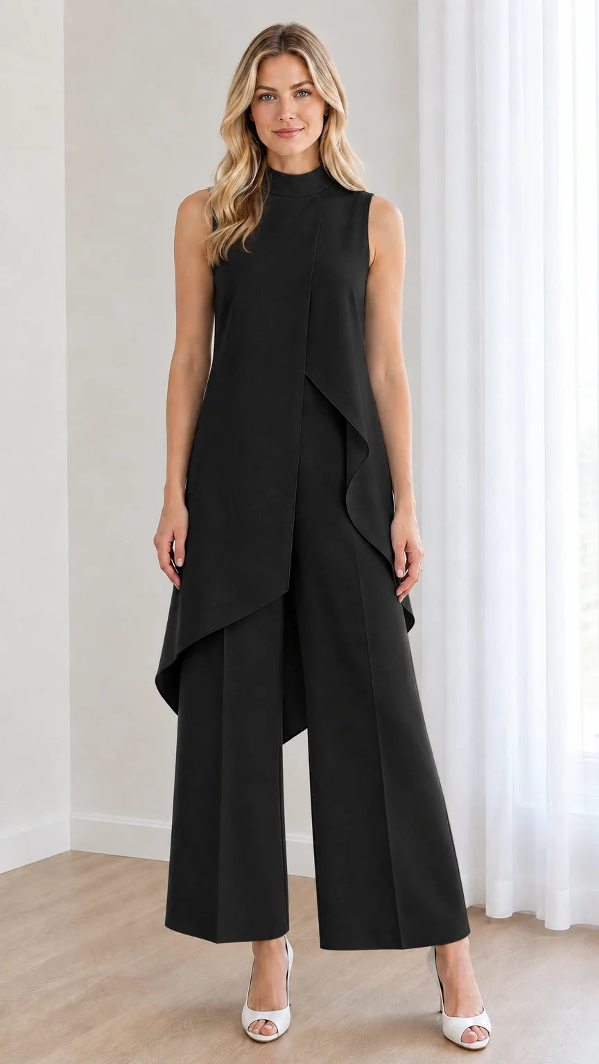Front view of black sleeveless mock neck wide leg jumpsuit