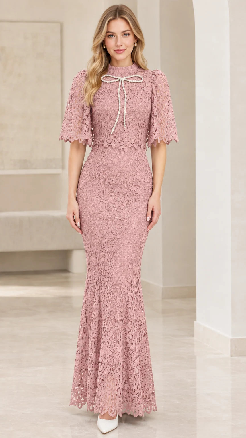 Front view of dusty pink lace capelet mermaid formal dress