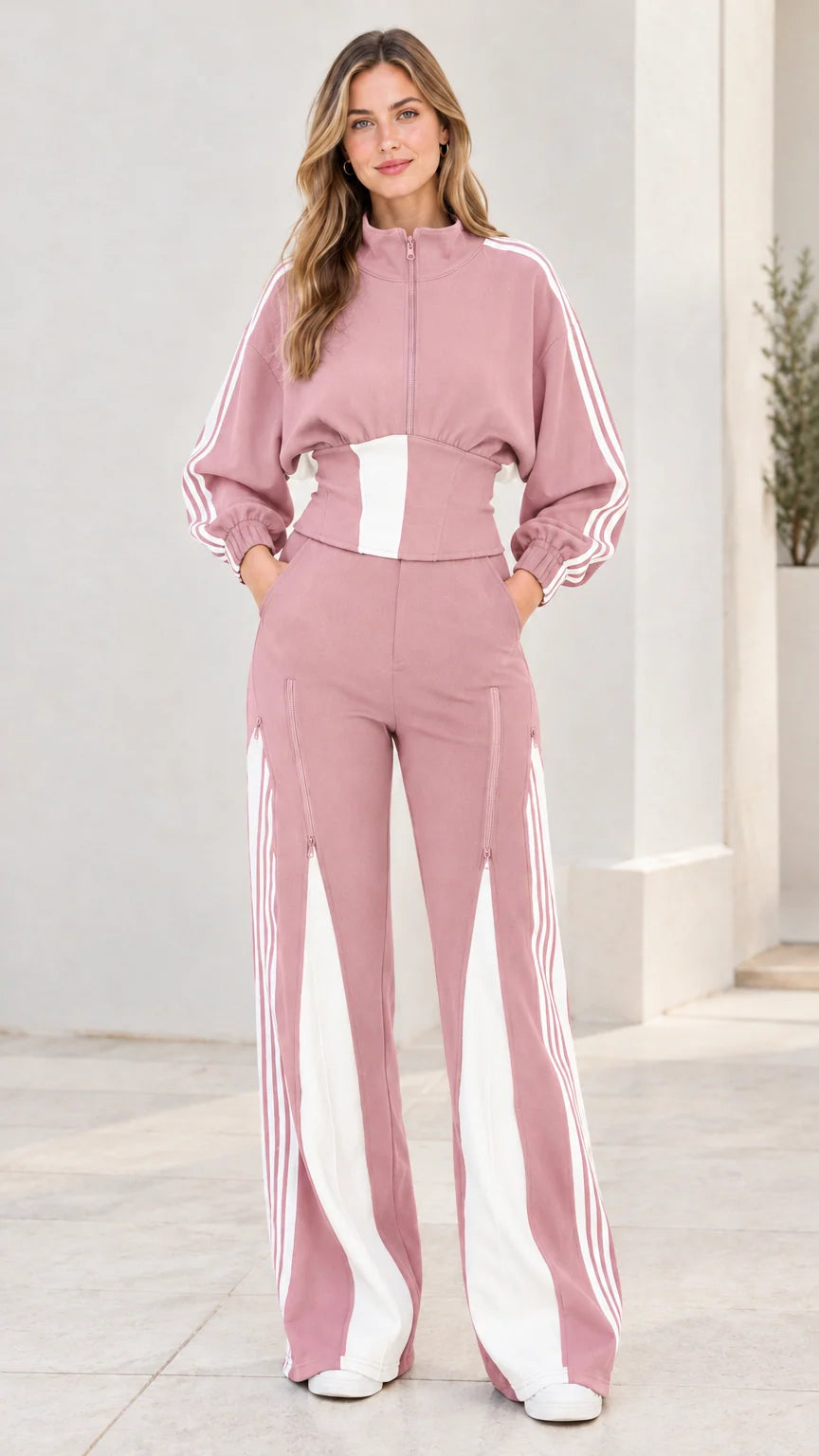 Front view of model wearing dusty pink two-piece striped tracksuit set