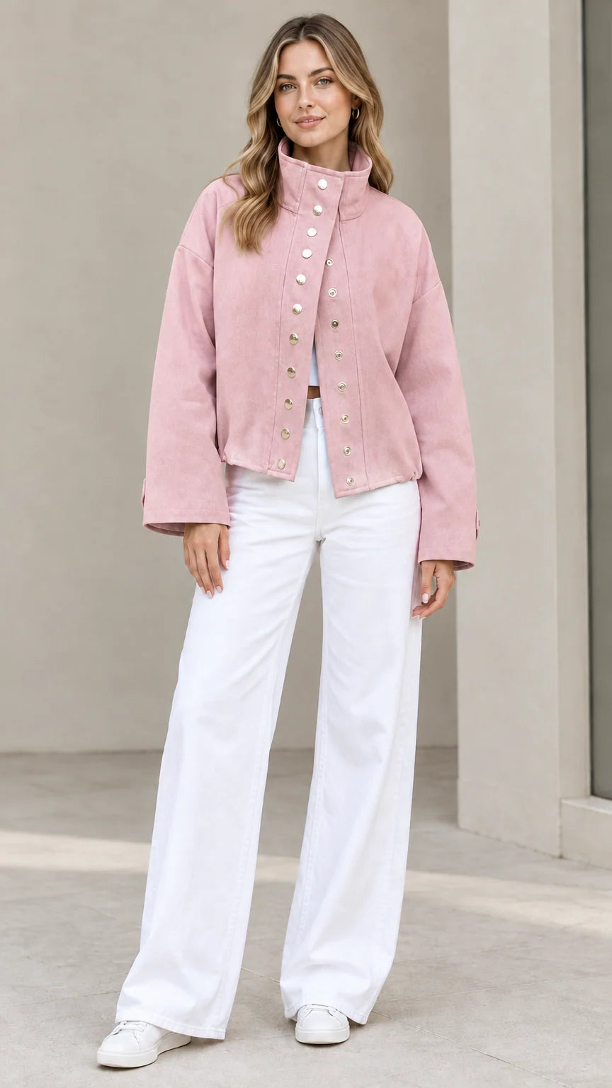 Full-length view of woman wearing Dusty Pink stand collar snap jacket with white pants
