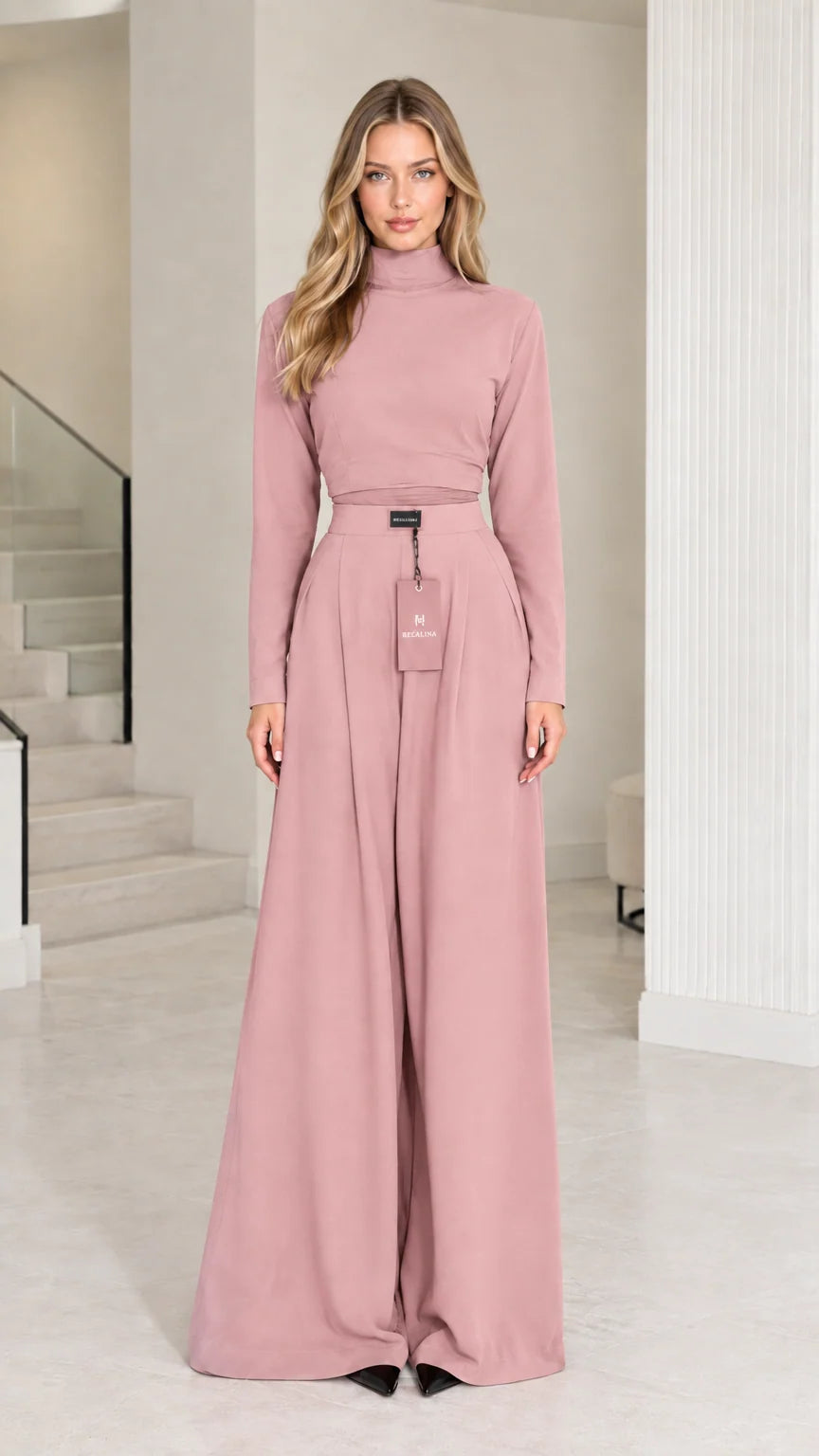 Front view of model wearing dusty pink mock neck top and matching palazzo pants set