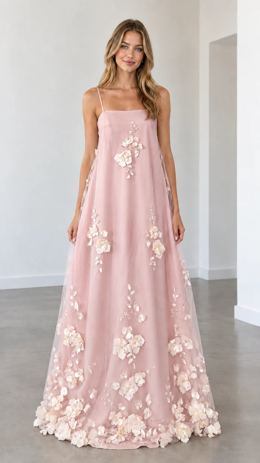 Model wearing blush pink 3D floral applique spaghetti strap maxi dress