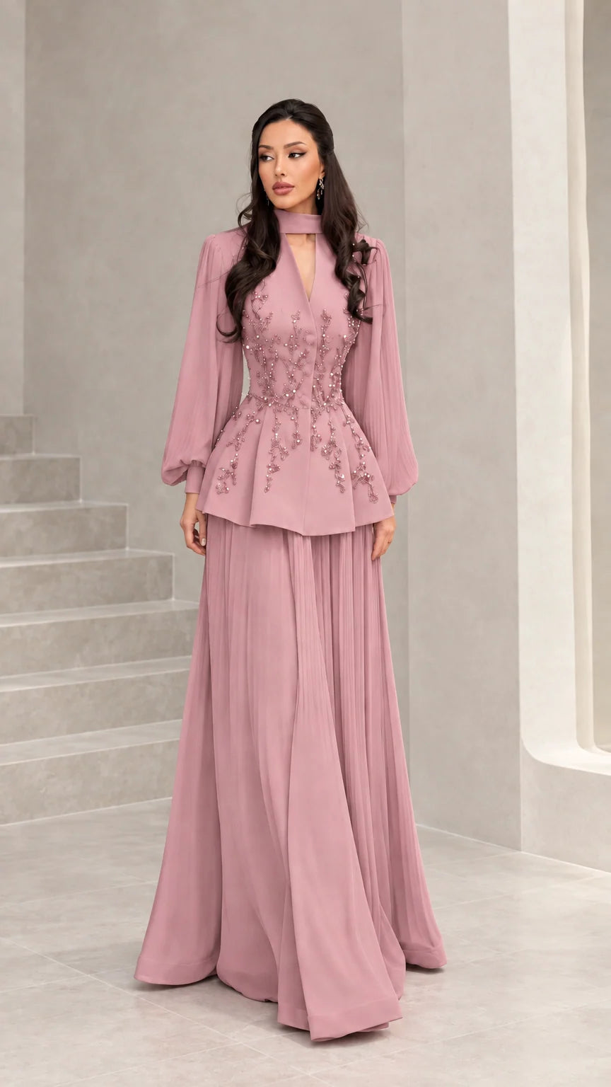Front view of dusty pink long-sleeve embellished peplum evening dress