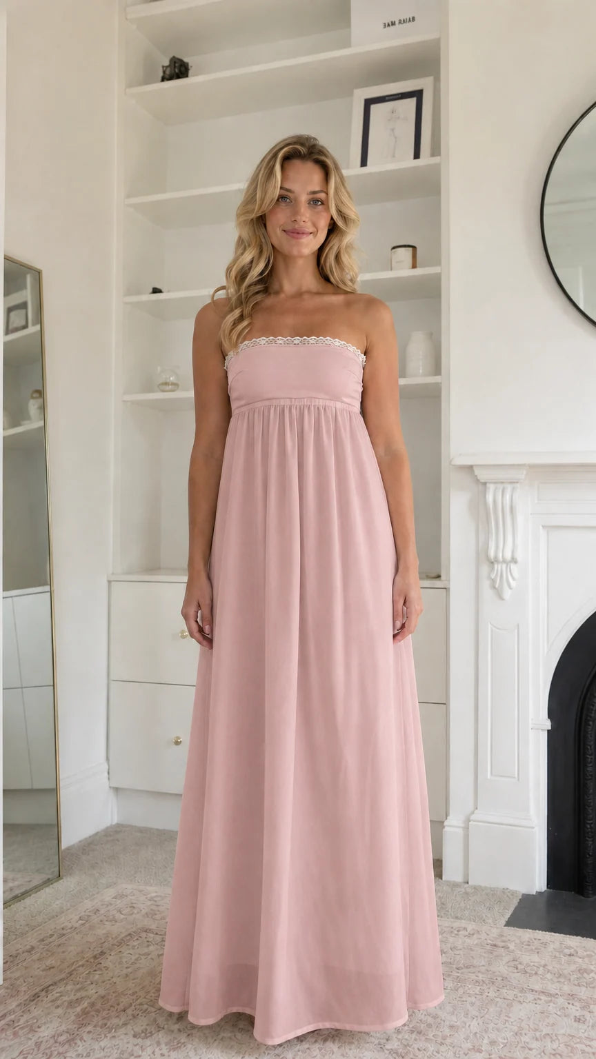 Woman wearing blush pink strapless maxi dress