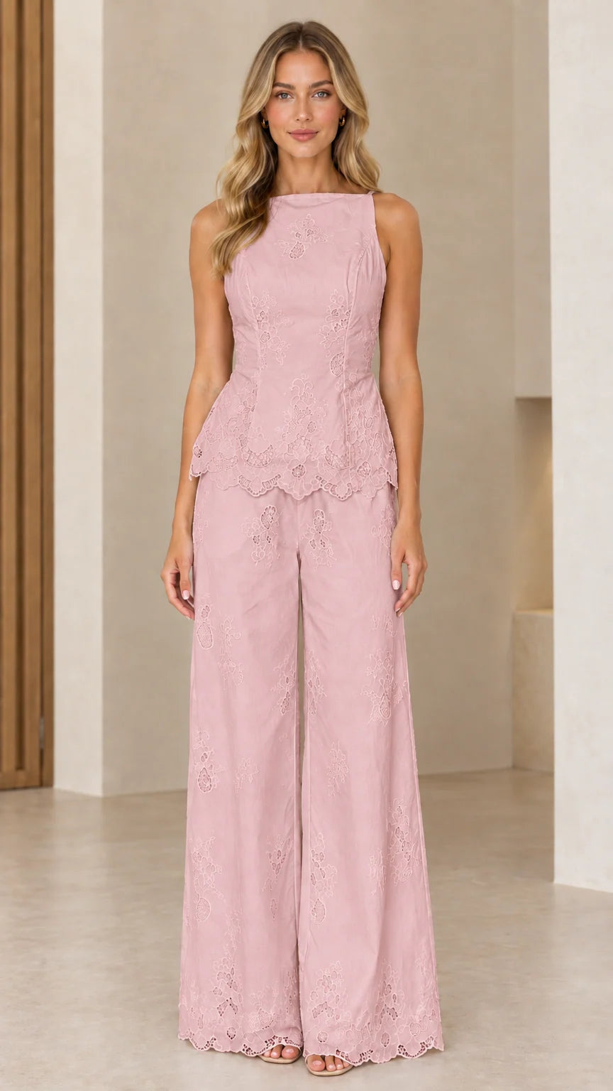 Full length view of model wearing blush pink embroidered peplum two-piece set