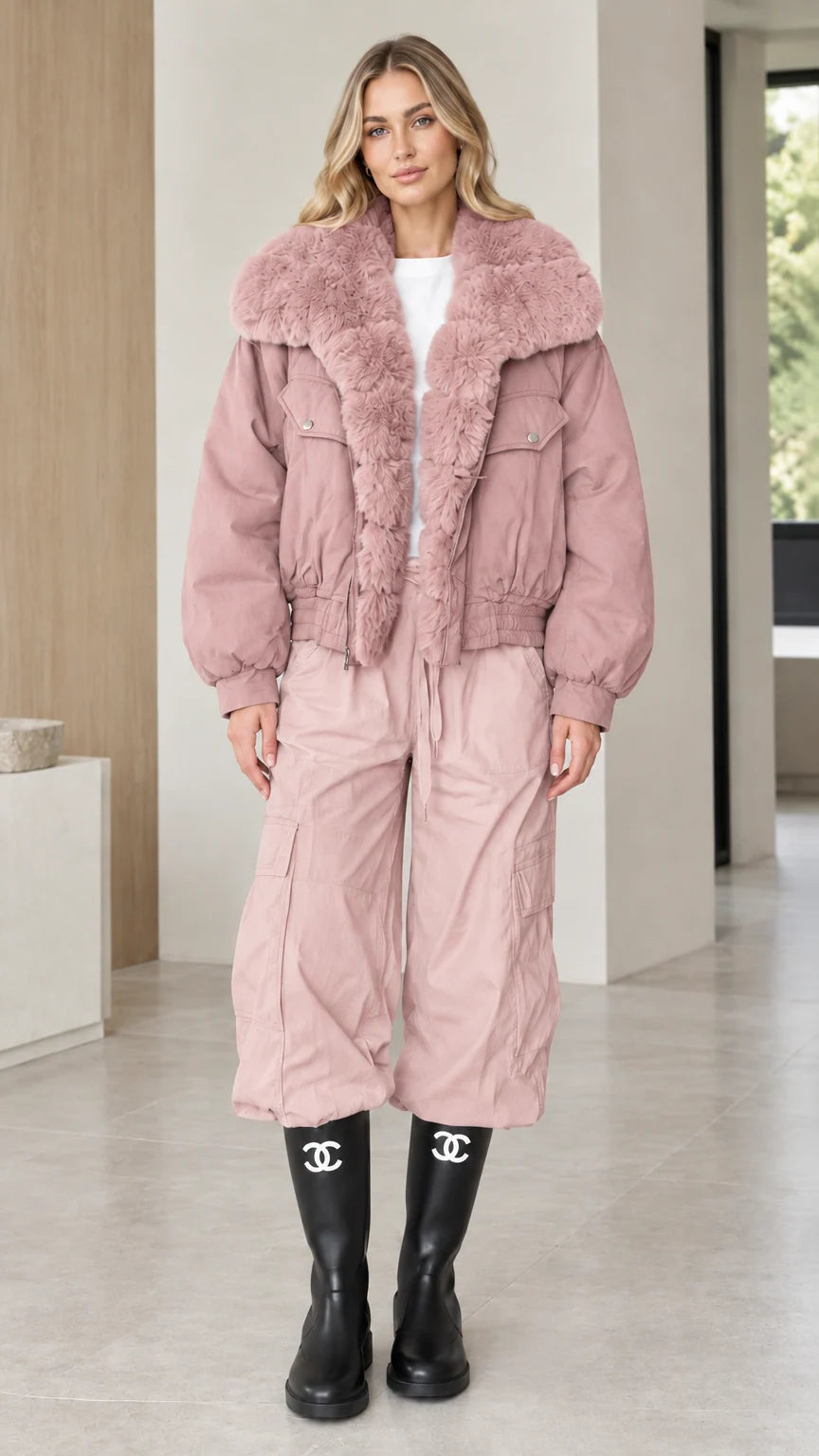 Model wearing dusty pink faux fur trim bomber jacket with matching pants