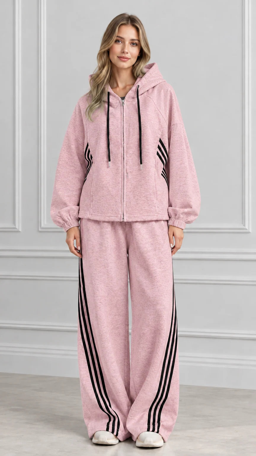 Front view of woman wearing Dusty Pink zip-up hoodie and wide-leg striped sweatpants set