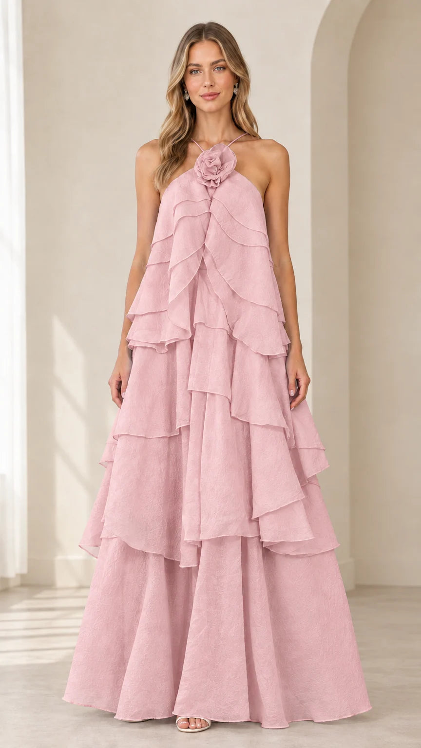 Full-length front view of model wearing Dusty Pink tiered ruffle halter gown