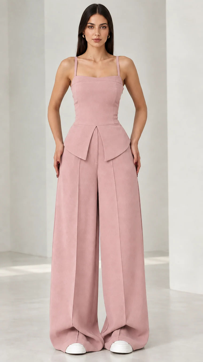 Full front view of model wearing dusty pink square neck peplum wide leg jumpsuit