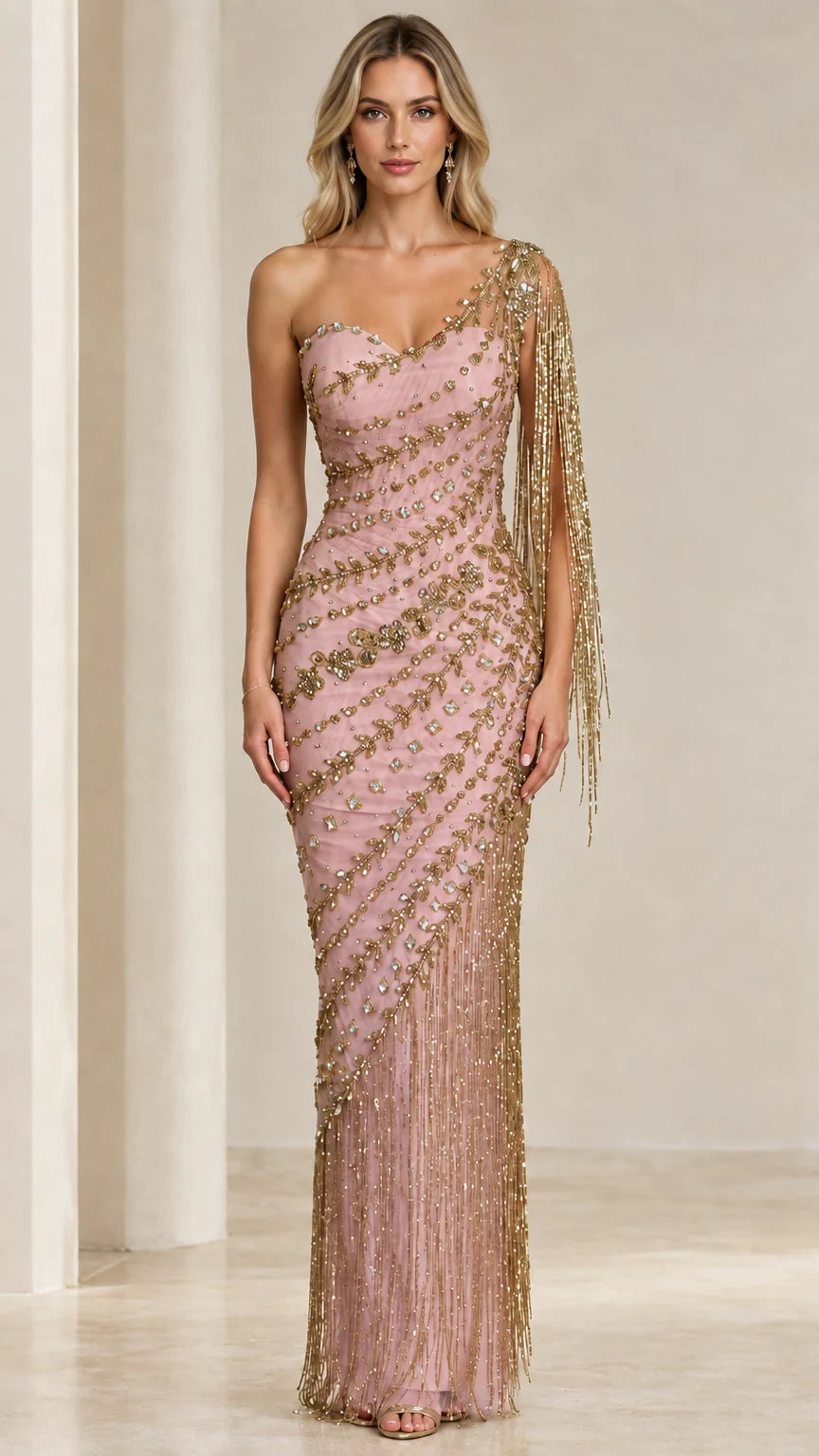 Front view of model wearing Blush Pink and gold one-shoulder beaded fringe evening gown
