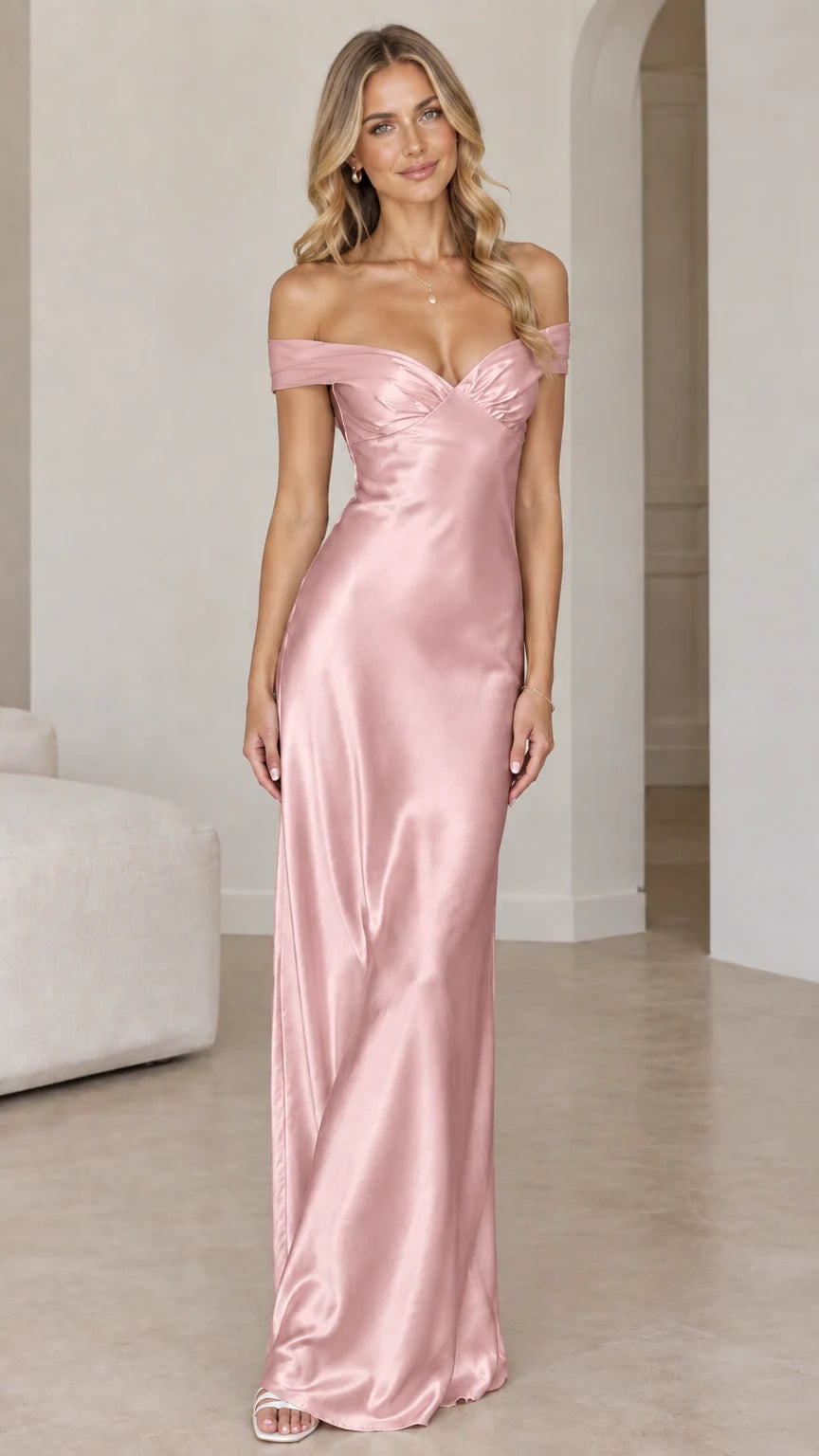 Front view of woman wearing blush pink off-the-shoulder satin maxi gown