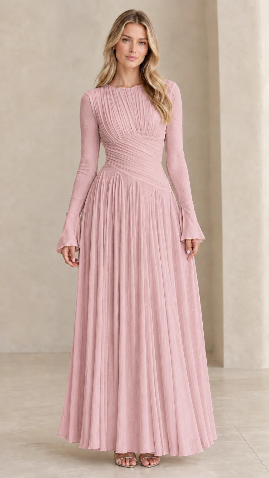 Model wearing dusty pink long sleeve pleated formal maxi dress