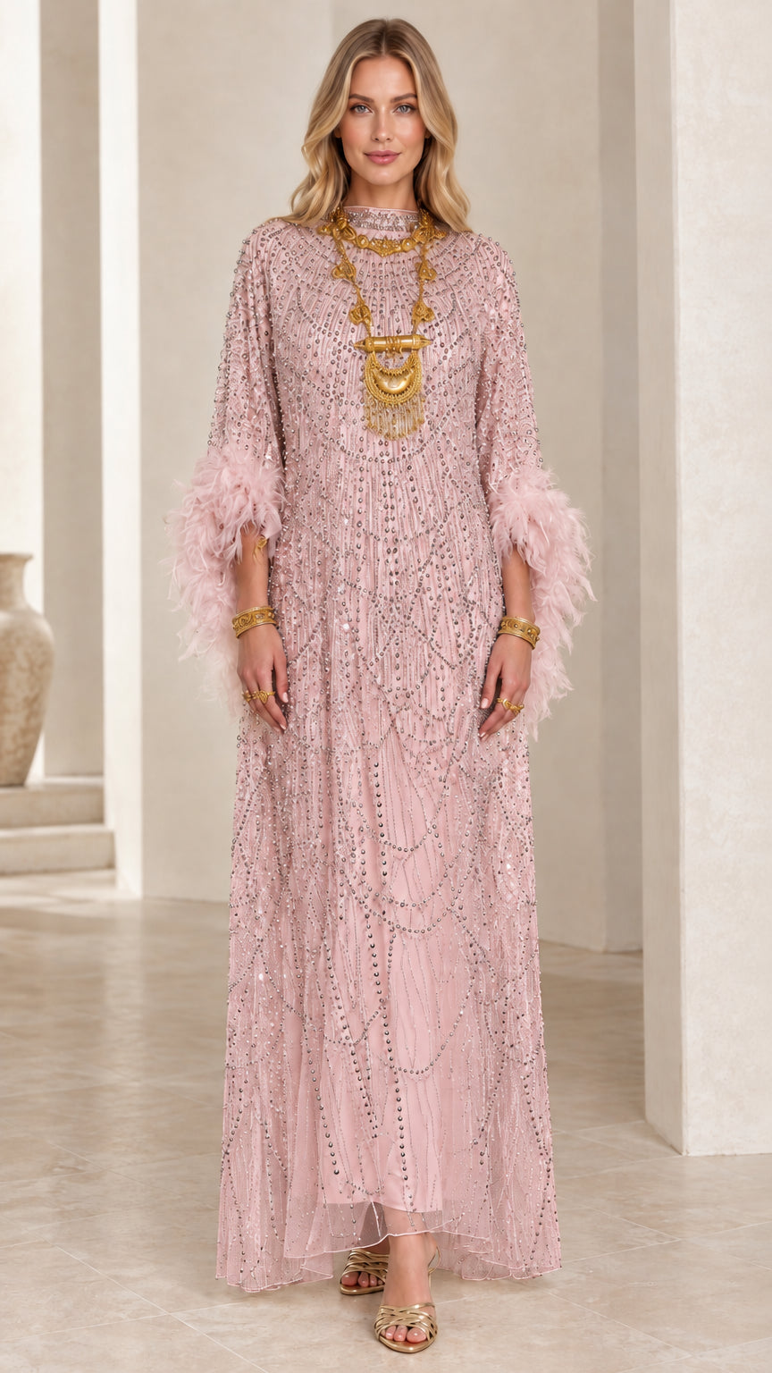 Front view of dusty pink beaded maxi evening dress with feather trim