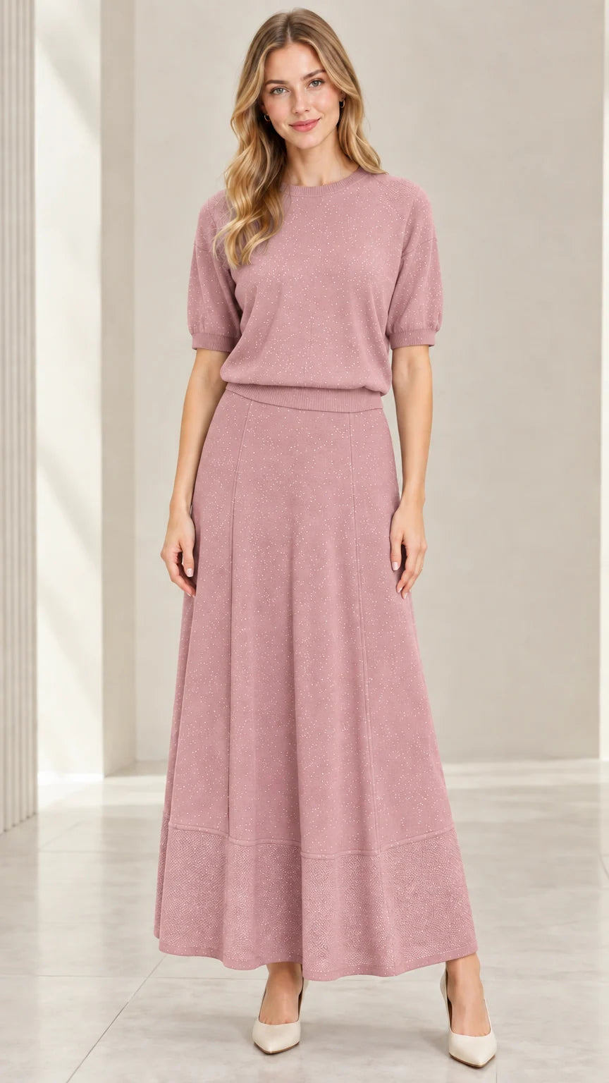 Model wearing dusty rose pink sparkle knit top and A-line maxi skirt set