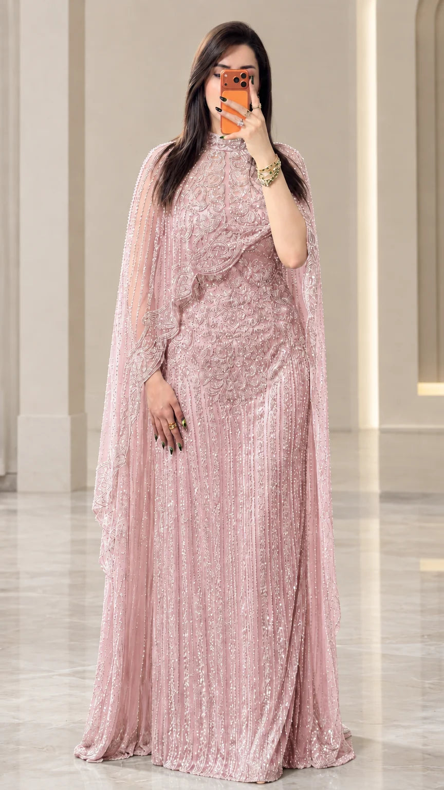 Full-length view of dusty pink sequined cape formal evening maxi dress