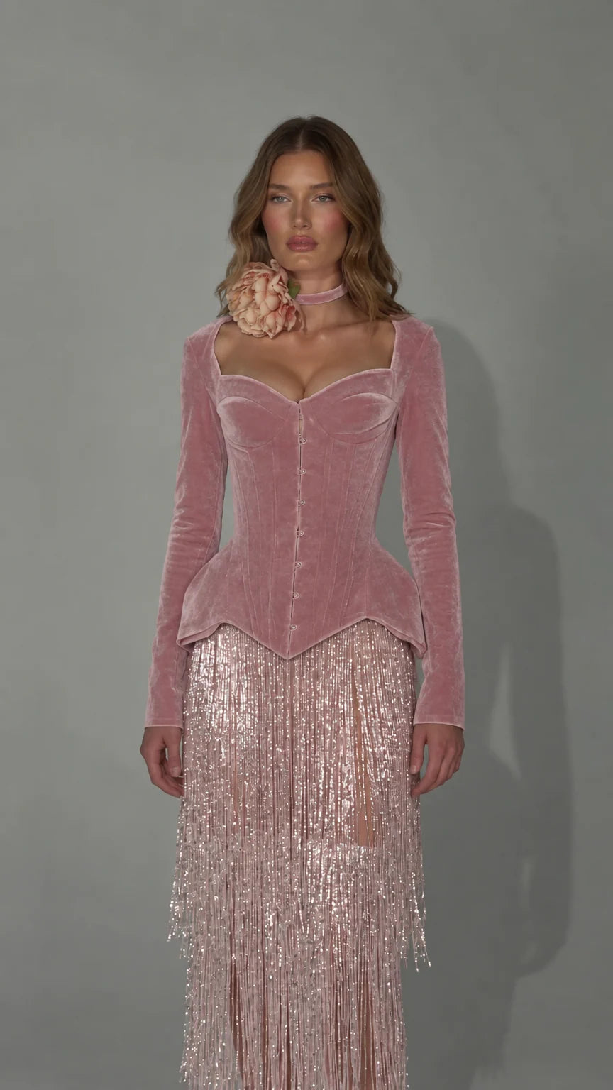 Front view of dusty pink velvet corset dress with matching sparkling fringe skirt