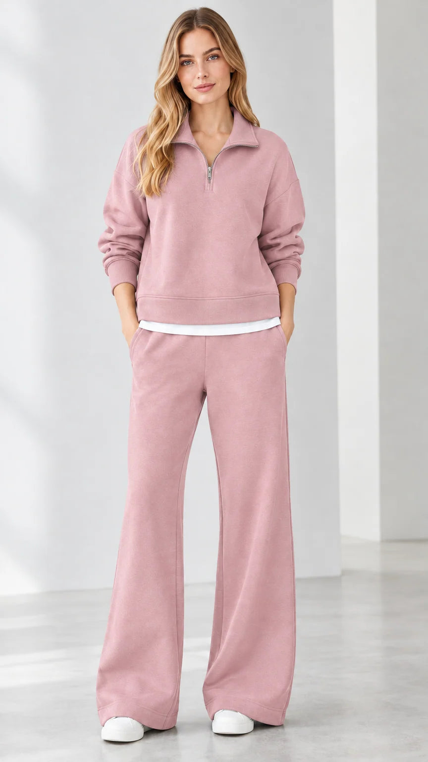Front view of model wearing dusty pink quarter-zip sweatshirt and wide-leg pants set