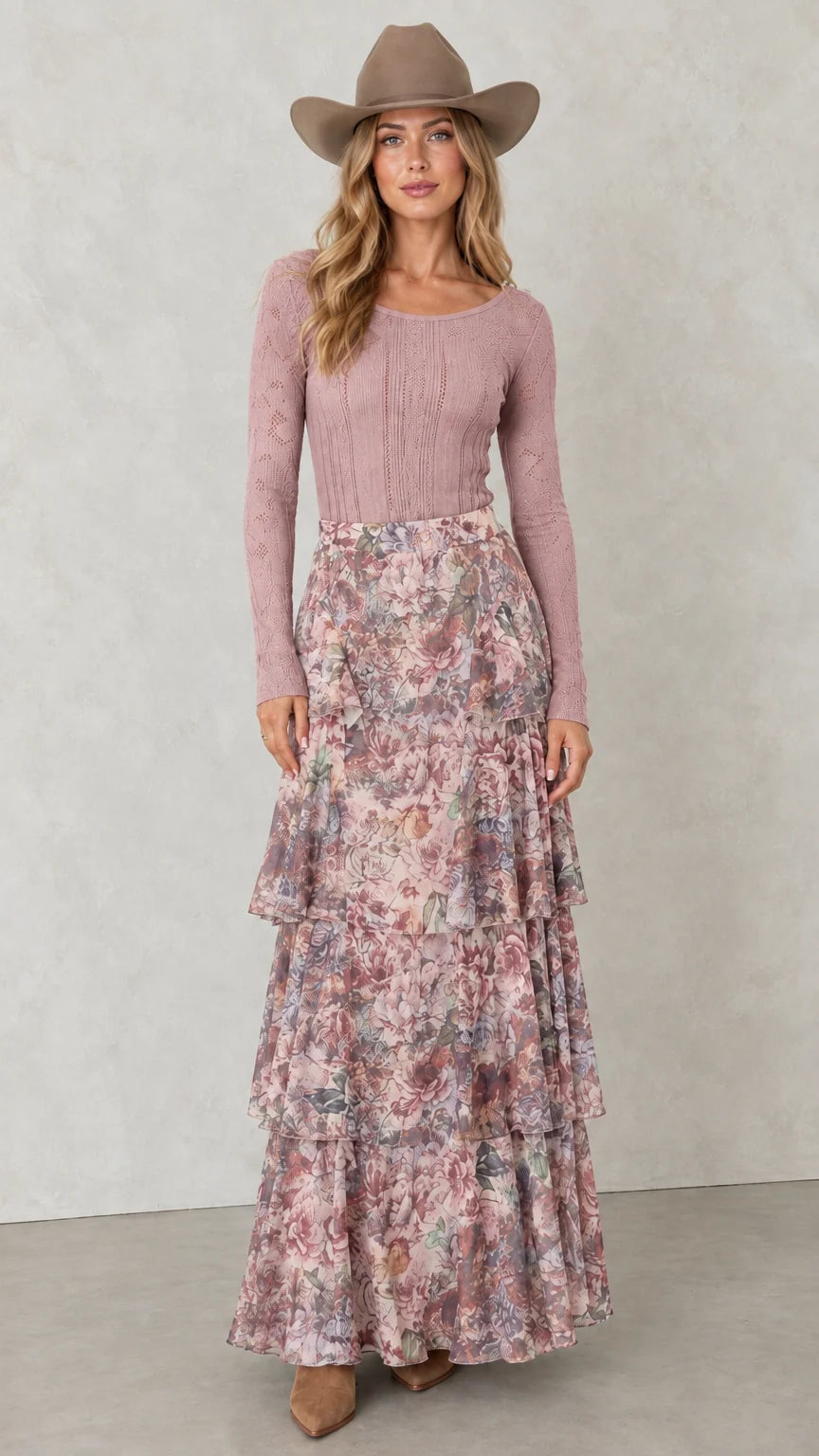 Model wearing Dusty Rose tiered floral maxi skirt with pink knit top