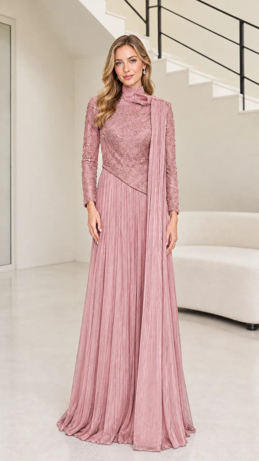 Front full-length view of dusty rose pink long sleeve embellished evening dress with shoulder drape